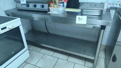 a kitchen with a stove and oven in it