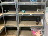 many shelves that are in the middle of a room