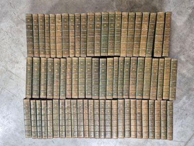a pile of old books stacked on top of each other