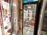 two refrigerators that are sitting in a store