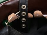 a close up of a purse with a leather strap