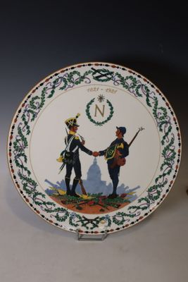 an image of a plate with a picture of two men shaking hands