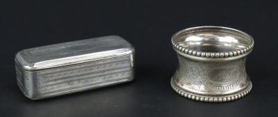a small silver container and a small silver box