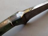 a knife that is sitting on a table