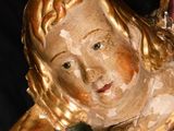 a statue of a woman holding a baby in her arms