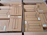 several boxes are stacked on top of each other on a table