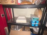 a shelf that has a bunch of boxes on top of it