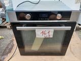 a black and silver oven with a price tag on it