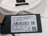 a close up of a white shirt with a tag on it