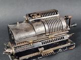 an old machine that is sitting on a table