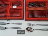 many forks and spoons in a red case