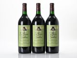 three bottles of wine sitting on top of a white surface