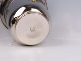 a silver cup with a gold star on it