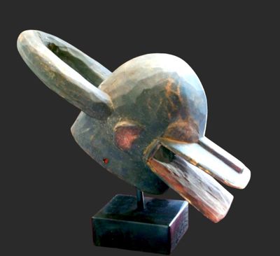 an image of a sculpture of a bird on a black base