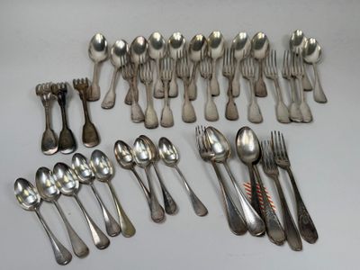 a lot of silver spoons and forks on the table
