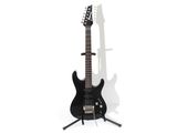 black electric guitar on stand against white background with shadow