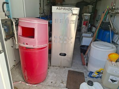 a refrigerator and a refrigerator freezer in a garage