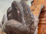 a statue of a hand that is on a table