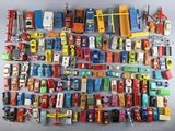 a lot of toy cars that are on the table