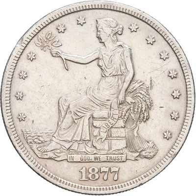 an old silver coin with a woman sitting on top of it