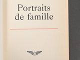 an open book with the title portraits de famille written on it