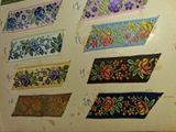 a lot of different designs on the wall of this room