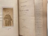 an old book with a picture of a man in a suit