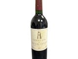a bottle of wine that is sitting on a table
