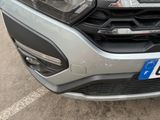 a close up of the front of a car with a number plate on it