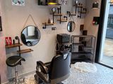 a barber chair in the corner of the room