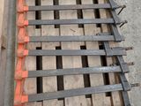 a wooden pallet with a bunch of nails on top of it