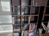 a room with a bookshelf and a window in it