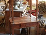 a wooden chair and a table in a room