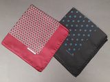two different colors of handkerchiefs on a table with a gray background