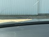the windshield of a car with a broken windshield glass on it