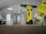 a box of cleaning supplies on a shelf next to a blow dryer