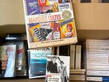 many books on a shelf in a box