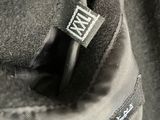 an image of a close up of a black jacket with a label on it