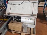 a machine that is sitting in the middle of a warehouse