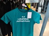 a t - shirt hanging on a rack in a clothing store