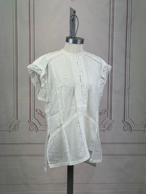 an image of a white shirt on a mannequin stand
