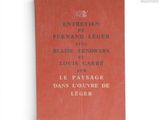 un vieux livre portant des inscriptions en français, posé sur une table