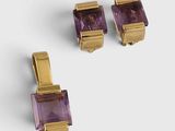 two pairs of amethorate earrings and a pair of gold - plated earrings