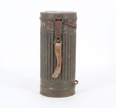 an old metal trash can with a wooden handle on a white background