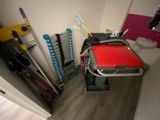 a red table in the corner of a room