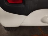 a close up of a car ' s tail light and the door handle