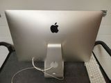 an apple computer sitting on top of a desk