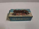an old box with a train on it sitting on a table