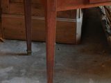 a small wooden table with a drawer underneath it