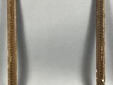 a pair of antique gold picture frames with a white background